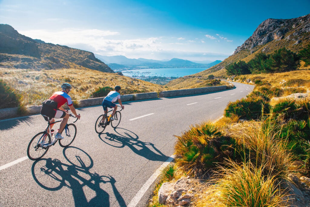Road cycling photo. Two triathletes train in Italy.