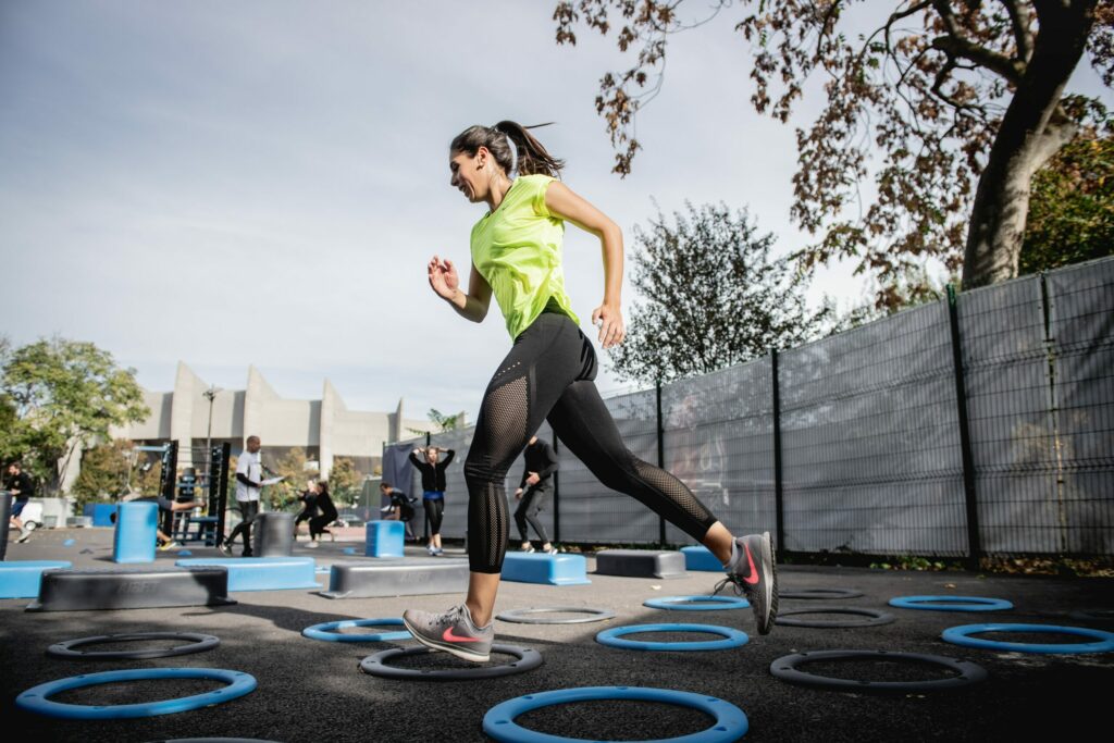woman in green tank top running