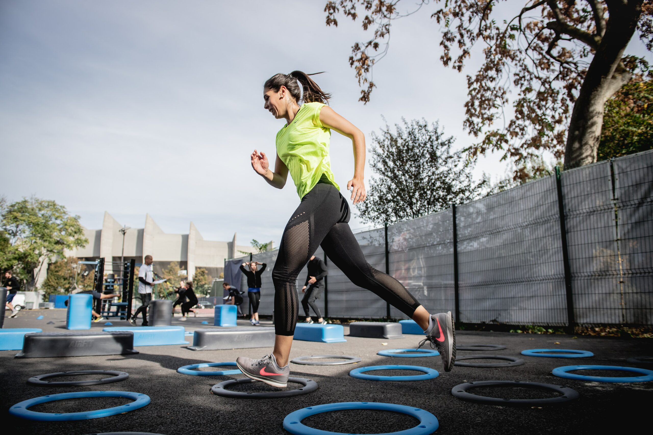 woman in green tank top running
