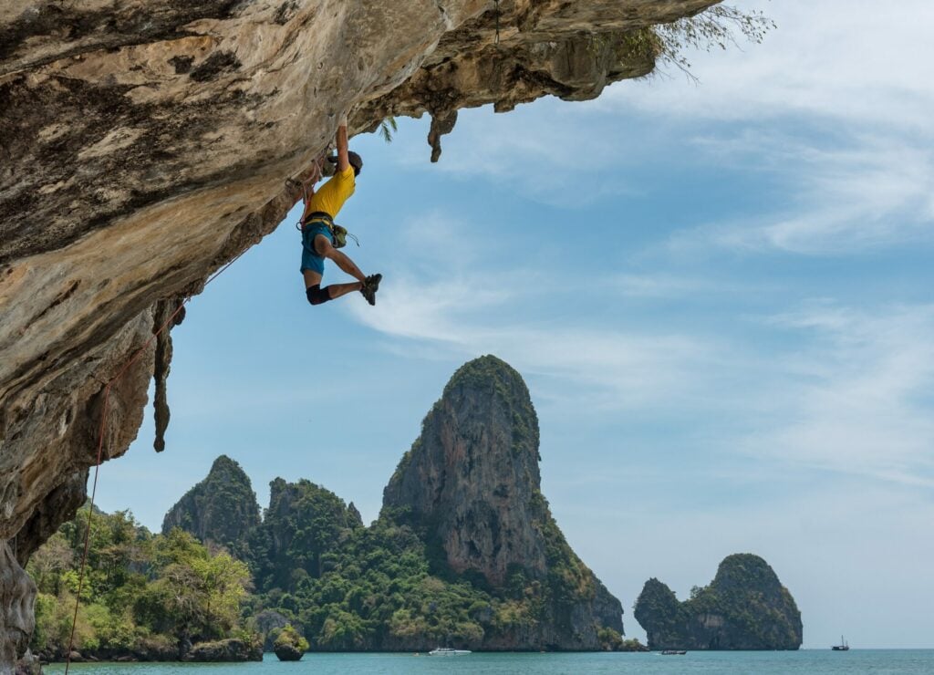 man rock climbing in tonsai beach
