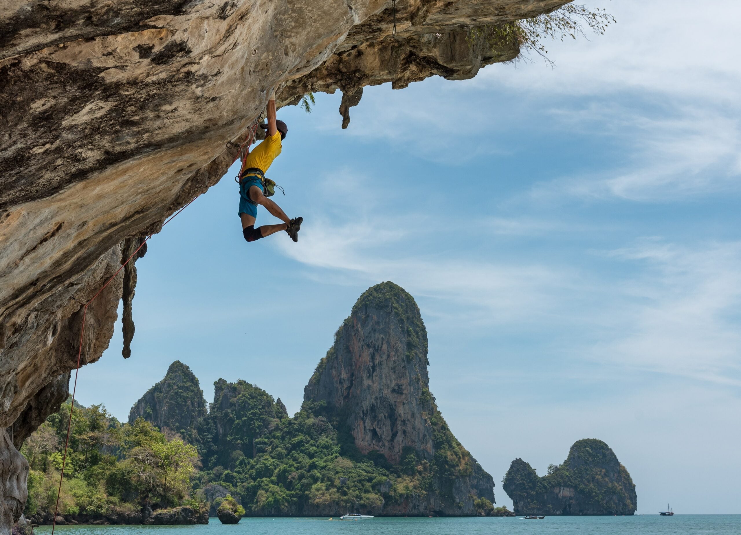 man rock climbing in tonsai beach