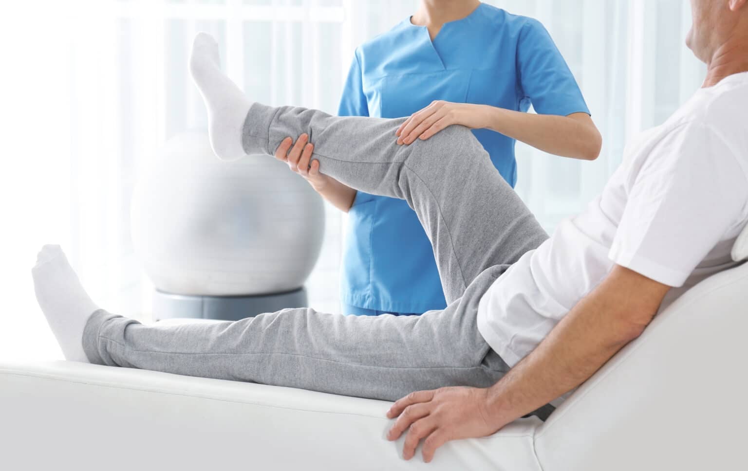 Doctor working with patient in hospital, closeup. Rehabilitation